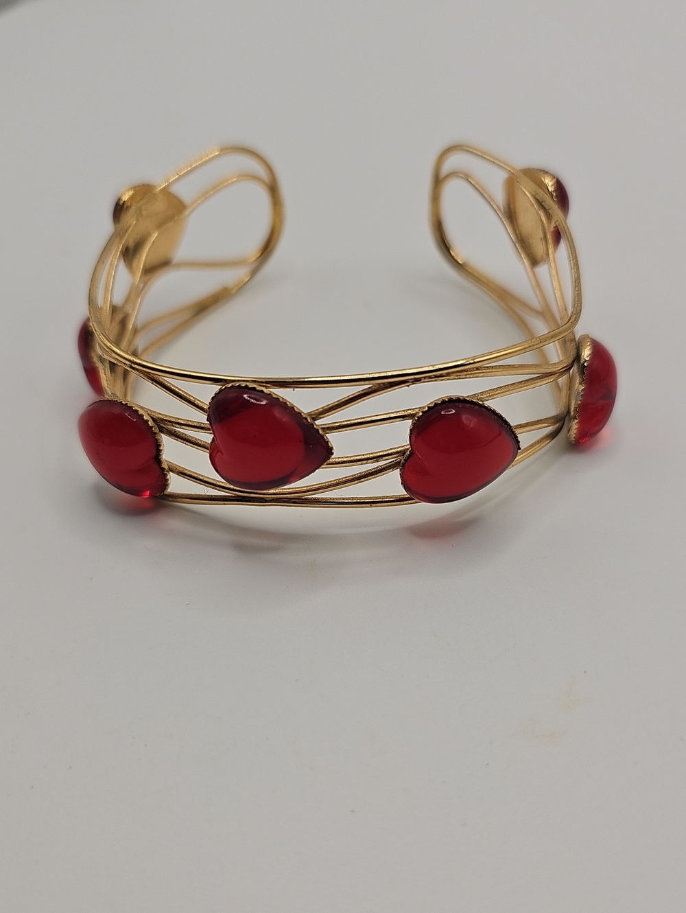 Gold-Tone Cuff Bracelet with Red Heart Cabochons.  Fits Most..